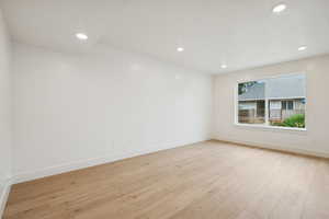 Spare room with light wood-style flooring and recessed lighting