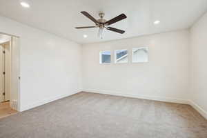 Unfurnished room with light carpet, recessed lighting, and ceiling fan