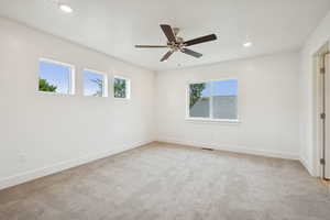 Unfurnished room featuring light carpet, recessed lighting, and ceiling fan