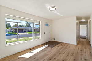 Foyer featuring light wood finished floors