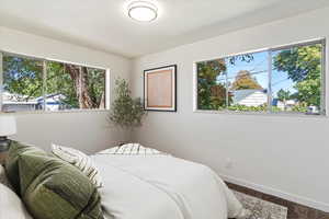 Carpeted bedroom featuring baseboards