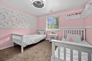 Bedroom with carpet and baseboards