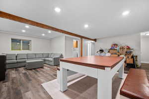 Playroom with recessed lighting, wood finished floors, and beam ceiling