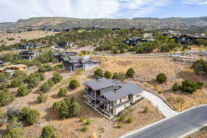 Aerial perspective of suburban area featuring a mountain backdrop