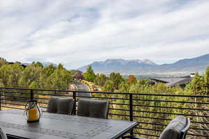 Balcony with a mountain view and outdoor dining space