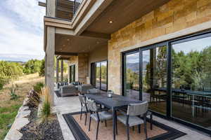 View of patio / terrace featuring outdoor lounge area, outdoor dining space, and a mountain view