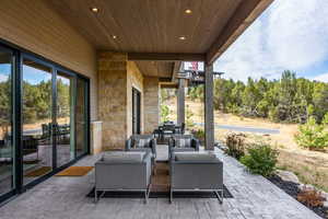 View of patio featuring an outdoor living space and outdoor dining area