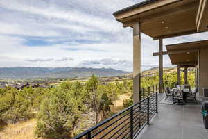 Balcony with a mountain view and outdoor dining area