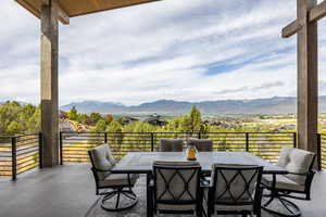 View of patio featuring outdoor dining area and a mountain view
