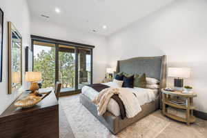 Bedroom featuring access to outside and recessed lighting