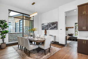 Dining room with light wood finished floors and baseboards