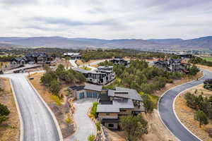Aerial view of residential area featuring mountains