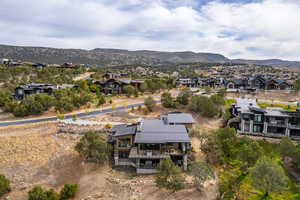 Aerial perspective of suburban area with a mountain backdrop