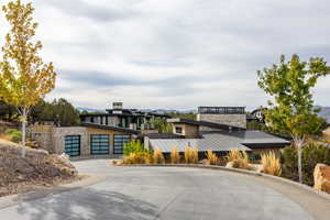 View of concrete road featuring curbs