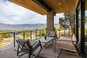 Balcony featuring an outdoor hangout area and a mountain view