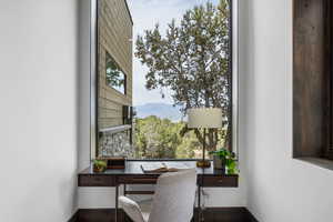 Office area featuring baseboards