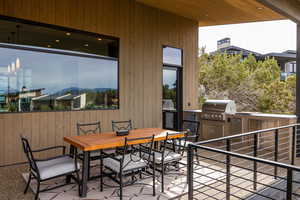 View of patio / terrace featuring outdoor dining area and an outdoor kitchen