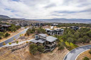 Aerial perspective of suburban area with a mountain backdrop