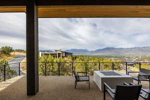 View of patio featuring a mountain view and an outdoor fire pit