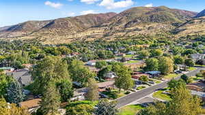 View of property location featuring a mountainous background and nearby suburban area
