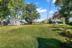 View of yard featuring an outbuilding and a mountain view