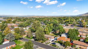 Aerial perspective of suburban area with a mountainous background