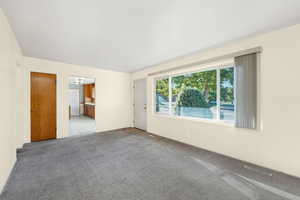 Empty room featuring carpet flooring