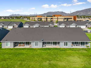 Aerial view of residential area featuring a mountainous background