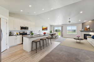 Open-concept layout with vaulted ceilings, bright natural light, and stunning model-home finishes — this home lives beautifully.