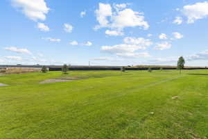 View of grassy yard with a view of countryside