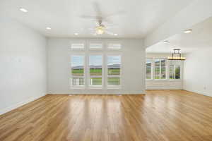 Unfurnished living room featuring recessed lighting, light wood finished floors, and a ceiling fan