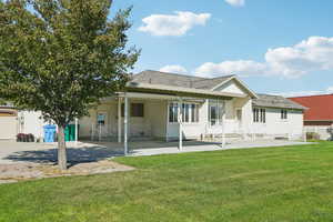 Back of house featuring a patio and stucco siding