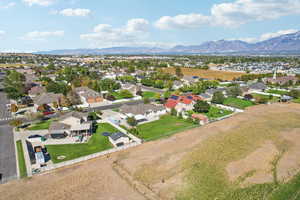 Aerial view of residential area featuring a mountainous background