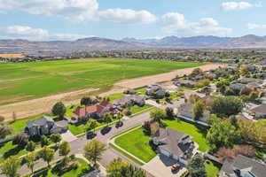 Aerial perspective of suburban area featuring a mountain backdrop