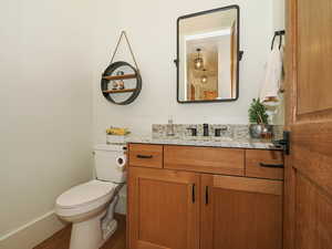 Bathroom featuring vanity and wood finished floors