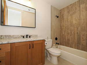 Bathroom with vanity and shower / bathtub combination