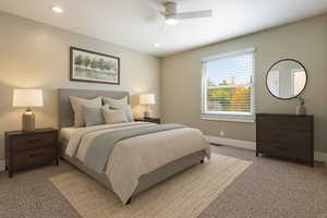 Bedroom with carpet floors, ceiling fan, and recessed lighting