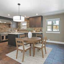 Dining space featuring recessed lighting and dark stone finish flooring