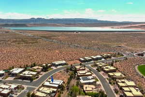Aerial perspective of suburban area with a mountain backdrop