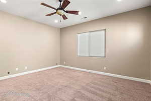 Spare room with light carpet, recessed lighting, and ceiling fan
