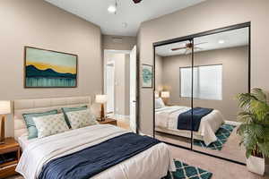 Carpeted bedroom featuring ceiling fan, a closet, and recessed lighting