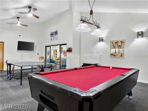 Game room with carpet, high vaulted ceiling, ceiling fan, pool table, and beamed ceiling