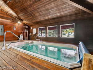 View of pool featuring a jacuzzi