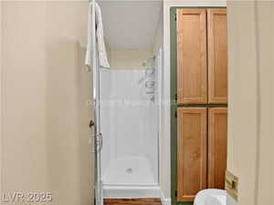 Full bathroom featuring a shower stall