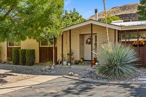 View of front of property featuring brick siding and a mountain view