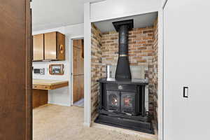Detailed view of a wood stove and brick wall