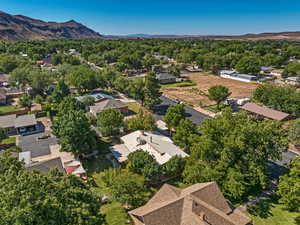 Aerial perspective of suburban area with a mountain backdrop