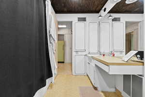 Bathroom with wood ceiling