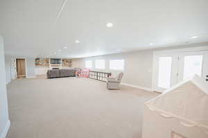 Bedroom with recessed lighting and light colored carpet
