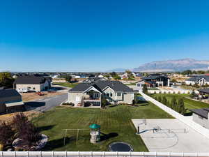 Aerial perspective of suburban area with a mountainous background